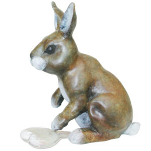 Bronze bunny sitting up on its hind legs